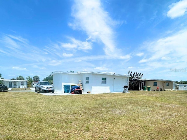 3116 Crestwood Dr, Port Charlotte, FL 33952 - back of house featuring a lawn