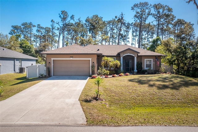 ranch-style house featuring a garage, stucco siding, and a front lawn