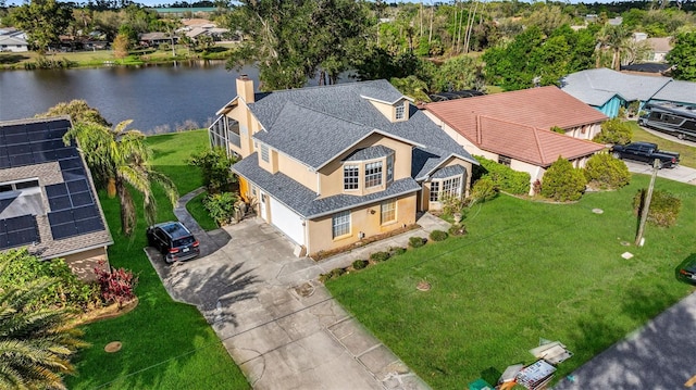 bird's eye view with a water view and a residential view