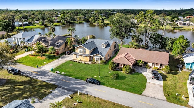 drone / aerial view featuring a water view and a residential view