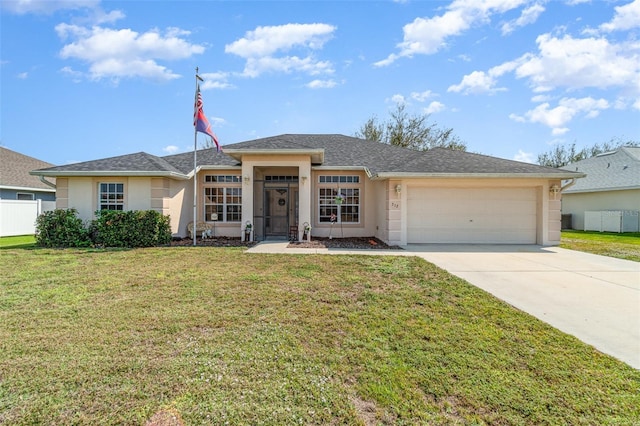 single story home featuring a garage, a front yard, driveway, and stucco siding