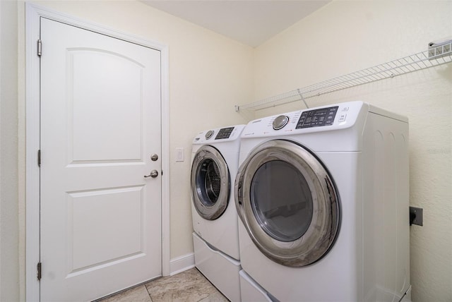 clothes washing area with laundry area and independent washer and dryer