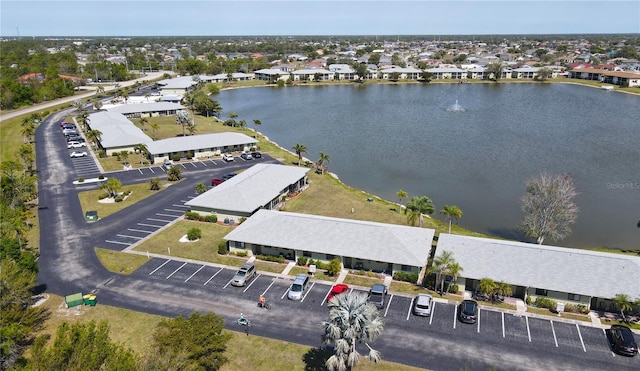 aerial view featuring a residential view and a water view