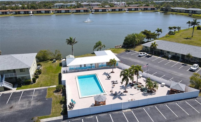 birds eye view of property with a water view