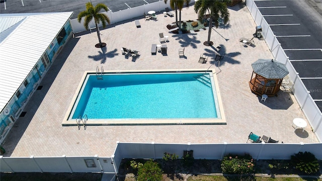 pool featuring a patio area and a fenced backyard