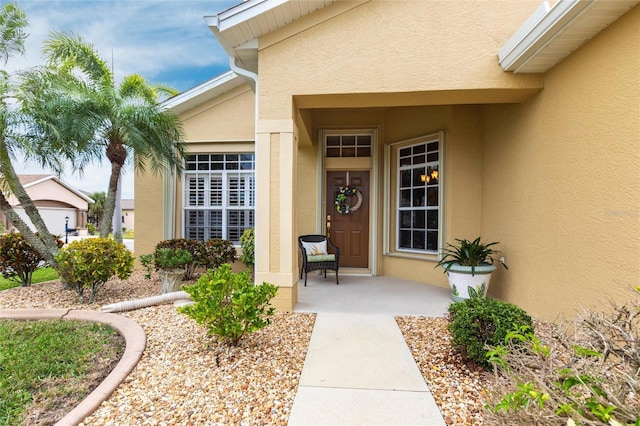 24321 Kintail Ct, Punta Gorda, FL 33980 - view of exterior entry with stucco siding