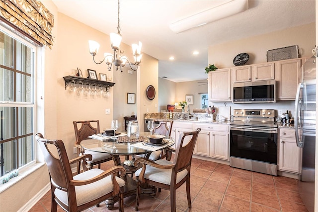 24321 Kintail Ct, Punta Gorda, FL 33980 - dining area featuring a chandelier, recessed lighting, light tile patterned floors, and baseboards