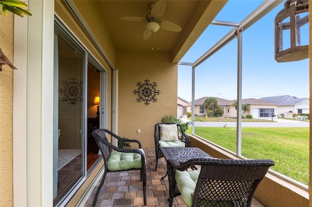 24321 Kintail Ct, Punta Gorda, FL 33980 - sunroom featuring ceiling fan and a residential view