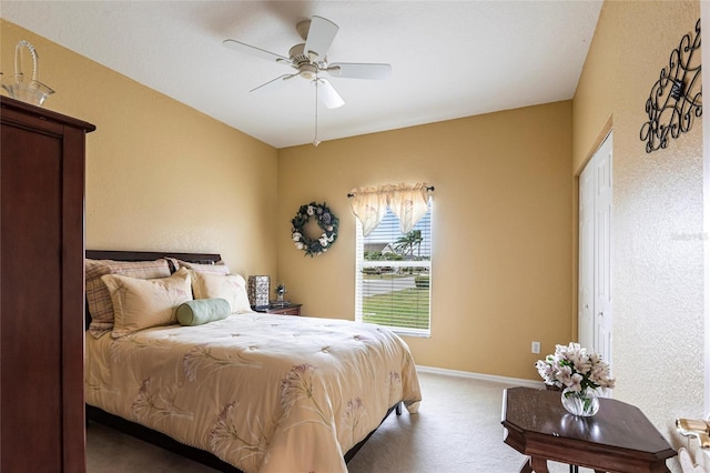 24321 Kintail Ct, Punta Gorda, FL 33980 - bedroom with baseboards, a ceiling fan, and carpet floors