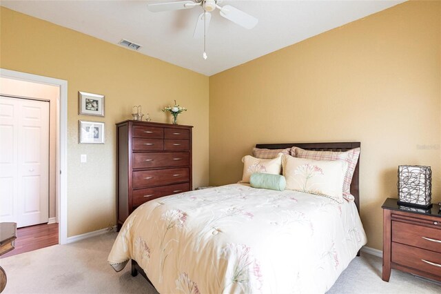 24321 Kintail Ct, Punta Gorda, FL 33980 - bedroom featuring light carpet, ceiling fan, baseboards, and visible vents