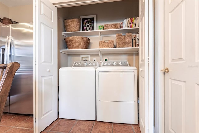 24321 Kintail Ct, Punta Gorda, FL 33980 - laundry area featuring tile patterned floors, independent washer and dryer, and laundry area