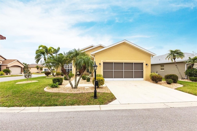 24321 Kintail Ct, Punta Gorda, FL 33980 - single story home with an attached garage, driveway, stucco siding, and a front lawn