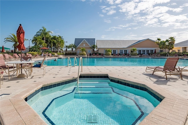 24321 Kintail Ct, Punta Gorda, FL 33980 - community pool featuring a patio area