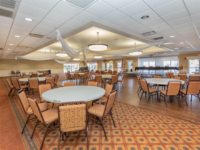24321 Kintail Ct, Punta Gorda, FL 33980 - dining space with visible vents, recessed lighting, a drop ceiling, and wood finished floors
