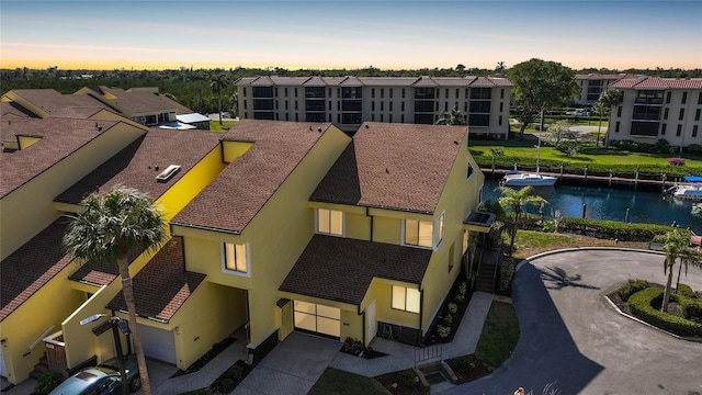 aerial view featuring a residential view and a water view