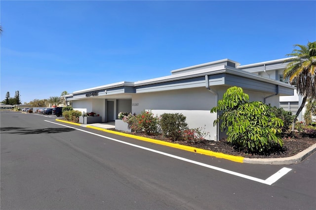 view of front of house featuring stucco siding