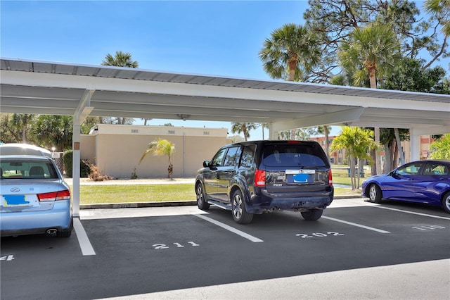 view of partially covered parking lot