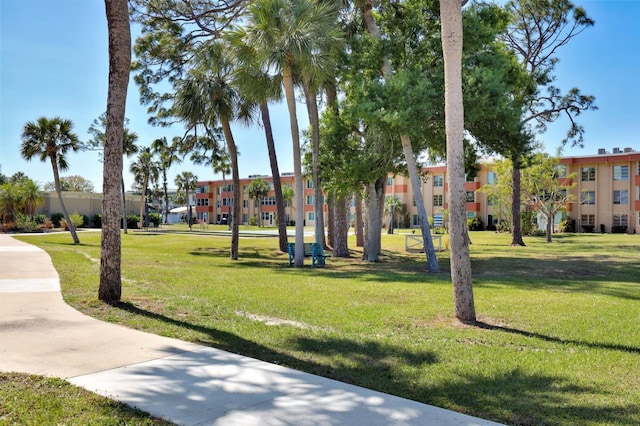 view of home's community with a lawn