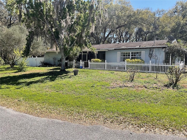3820 E Orange Dr, Hernando, FL 34442 - ranch-style home featuring a fenced front yard and a front lawn
