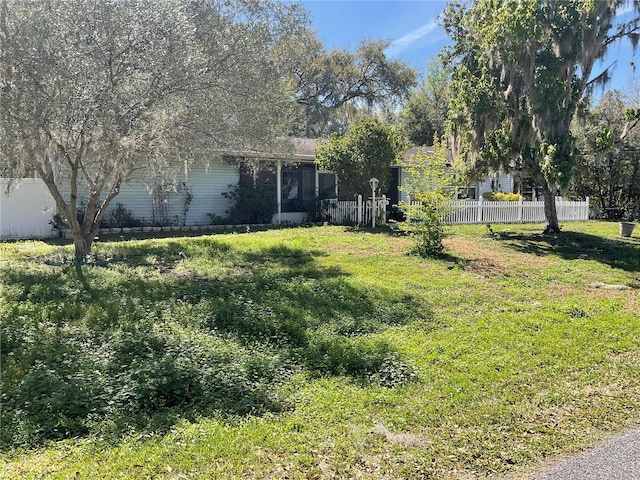 view of yard featuring fence