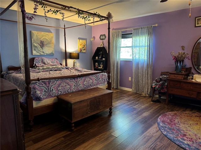 bedroom with wood finished floors