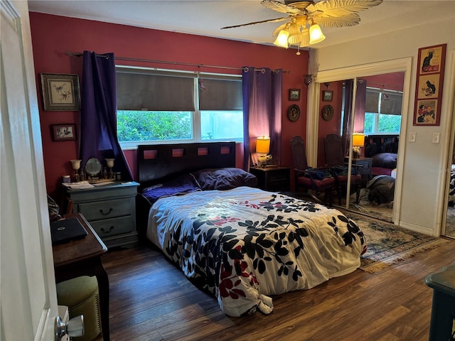 bedroom with baseboards, a ceiling fan, and wood finished floors