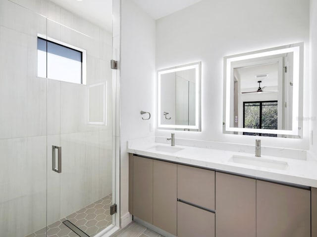 full bathroom with plenty of natural light, a sink, and a shower stall