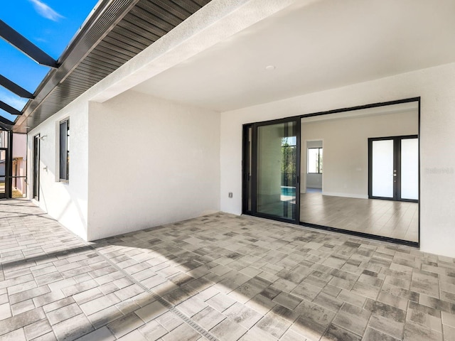 view of patio / terrace with glass enclosure