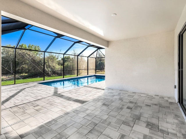 pool with a lanai and a patio area