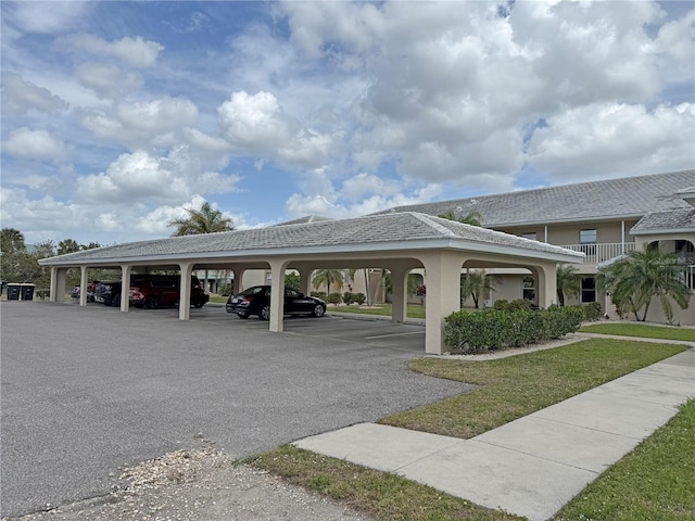 view of community featuring covered parking