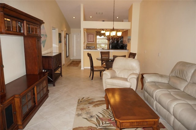 living room with light tile patterned floors, recessed lighting, visible vents, vaulted ceiling, and a chandelier