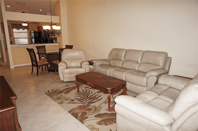 living area featuring recessed lighting, a notable chandelier, and light tile patterned floors