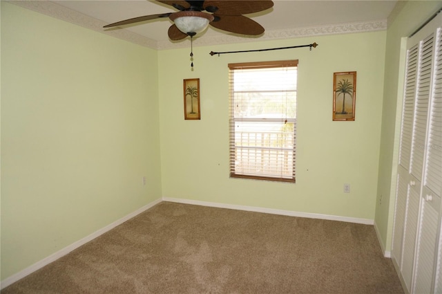 unfurnished room featuring baseboards, carpet flooring, and ornamental molding