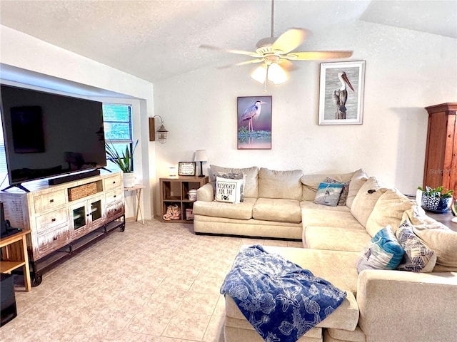 living area featuring a ceiling fan, vaulted ceiling, and a textured ceiling