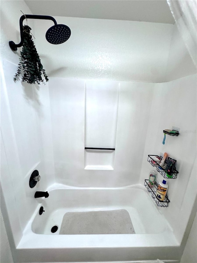 bathroom with shower / bath combination