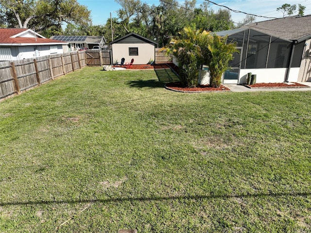 view of yard with a fenced backyard and a sunroom