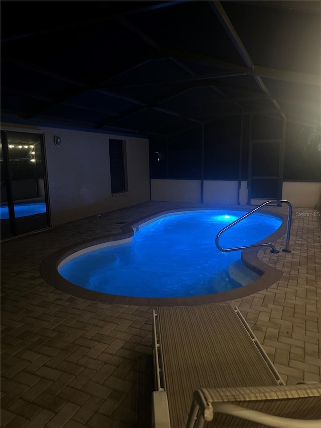 view of swimming pool with a jacuzzi