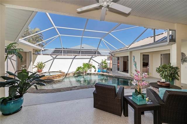 outdoor pool with a patio area, glass enclosure, an in ground hot tub, and a ceiling fan