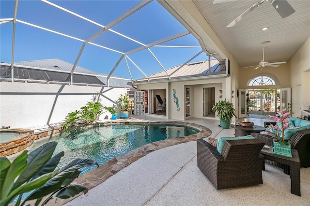 pool featuring glass enclosure, a ceiling fan, an outdoor living space, an in ground hot tub, and a patio area