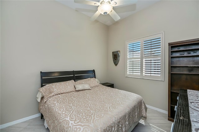 bedroom with baseboards and ceiling fan