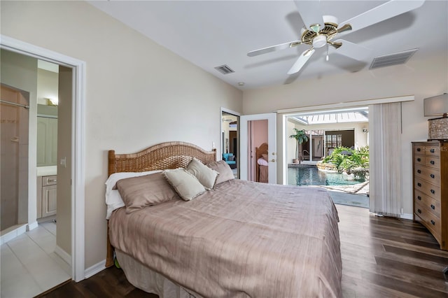 bedroom featuring access to exterior, wood finished floors, visible vents, and baseboards