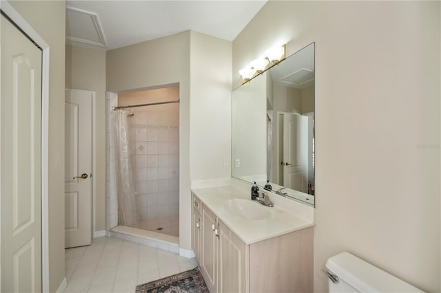 bathroom featuring vanity, tile patterned floors, toilet, and a tile shower