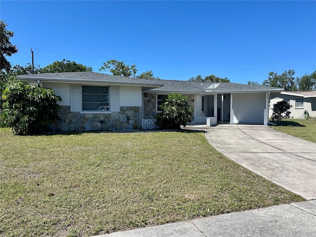 ranch-style home with stone siding, concrete driveway, roof with shingles, and a front yard