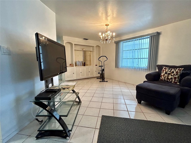 living room featuring a notable chandelier and light tile patterned floors