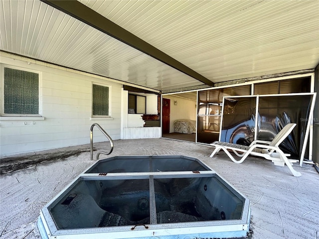 view of patio / terrace with a jacuzzi