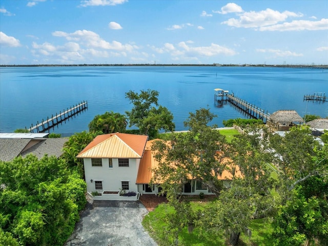 birds eye view of property with a water view