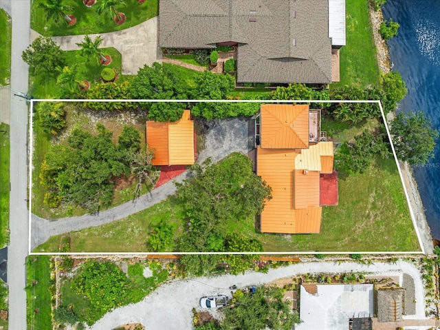 birds eye view of property with a water view