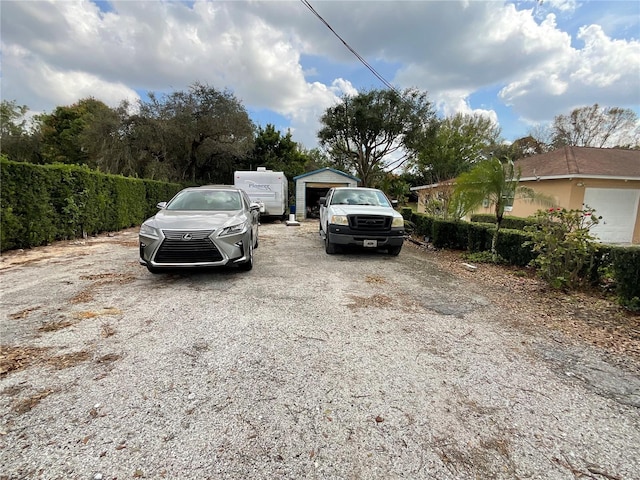 view of parking featuring fence