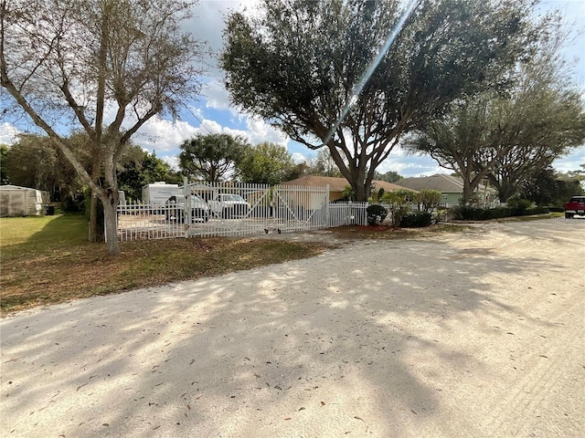 view of front of property with fence and a gate