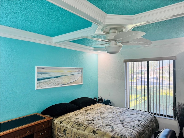 bedroom with ornamental molding, coffered ceiling, a textured wall, and ceiling fan